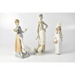 LLADRÓ; three figures comprising two girls with geese and a girl holding a basket with a stick,