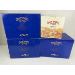 Four boxed large David Winter cottages comprising 'Mr Bumble's Xmas 1997', 'Tiny Tim Xmas 1996',