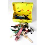 A vintage yellow and floral card jewellery box containing a quantity of wristwatches to include a