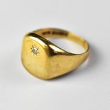 A gentlemen's heavy 9ct gold signet ring with square top and tiny star set diamond to the centre