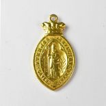 A yellow metal pendant fob with a Bishop to the front with Latin inscription within banded edge,