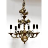 A brass six-branch electrolier with Ho Ho bird finial above six scrolls with stylised flowers,