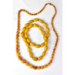 Two strands of amber-style beaded necklace.