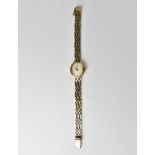 ROTARY; a ladies' modern watch with a 9ct gold head,