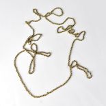 A continuous gold muff chain with a swivel clasp, length 160cm, approx 35g.