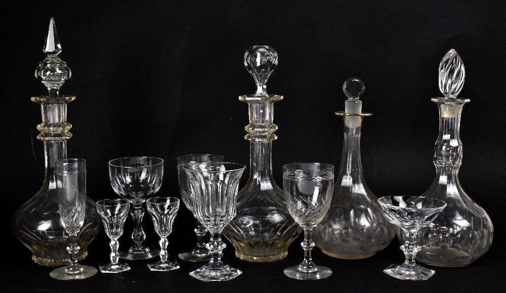 A large quantity of glassware including decanters, drinking glasses, trumpet epergne, etched goblet,