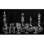 A large quantity of glassware including decanters, drinking glasses, trumpet epergne, etched goblet,