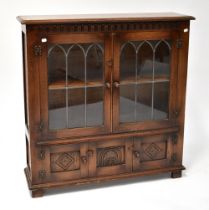 REPRODUX; an oak glazed bookcase,
