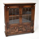 REPRODUX; an oak glazed bookcase,