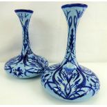 MOORCROFT; a modern pair of 'Rachel' pattern onion-shaped vases with slender necks and flared rims,