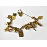 A 9ct gold belcher link charm bracelet united with a heart-shaped padlock clasp,