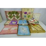 A group of vintage textiles, mostly boxed items to include handkerchiefs, linen, towels,