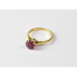 A 9ct gold ruby ring with claw set round cut ruby, size R, approx 3.2g.