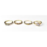 Four 9ct gold dress rings, one with marquise-shaped lilac-coloured stones, in a diagonal line,