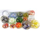 Fifteen mostly modern art glass paperweights, some with swirls, flowers and bubbles (15).