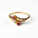 A ruby and diamond crossover ring,