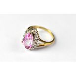 A 9ct gold dress ring with a three-claw set pink cut pear-shaped stone (possibly pink sapphire),