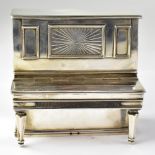 A Victorian hallmarked silver gilt tabletop cigarette box and striker in the form of an upright