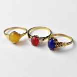 Three 9ct gold dress rings with different coloured stones, comprising a blue stone example, size O,