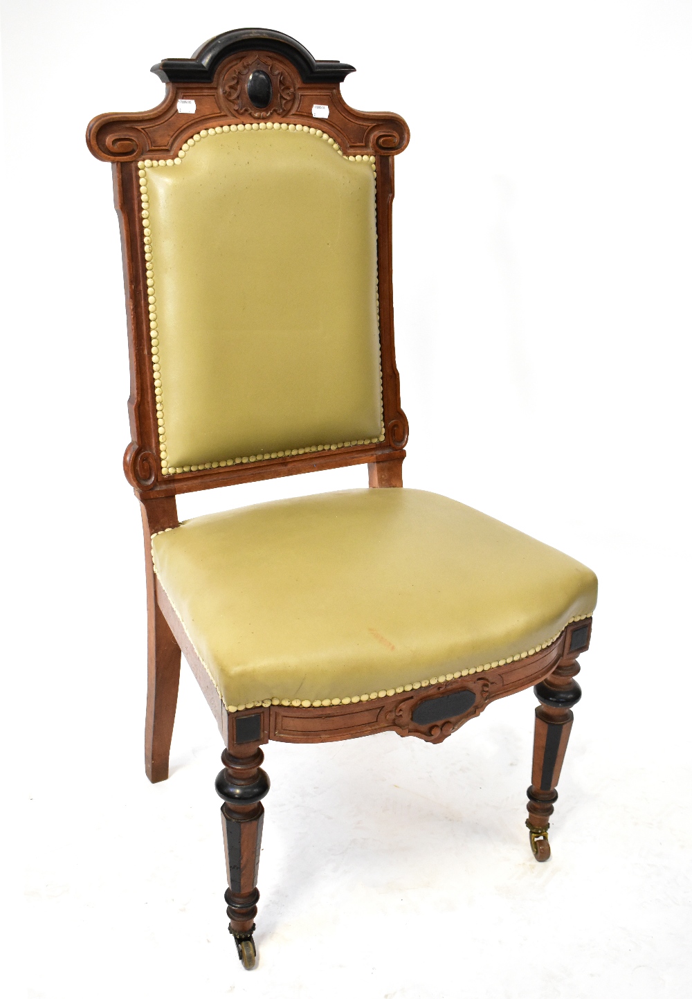 A late 19th century Continental walnut hall chair with padded back and seat,