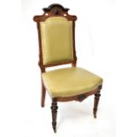 A late 19th century Continental walnut hall chair with padded back and seat,