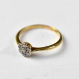 An 18ct gold tiny diamond floral cluster ring, size O, approx 2g.