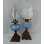 Two late 19th/early 20th century paraffin lamps,