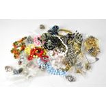 A quantity of costume jewellery to include beads, necklaces, chains, magnetic bracelets, brooches,