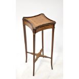 A late 19th/early 20th century marquetry inlaid mahogany stand with square and concave side top and