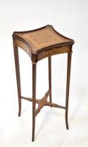 A late 19th/early 20th century marquetry inlaid mahogany stand with square and concave side top and
