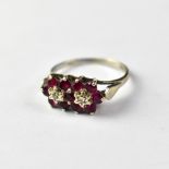 A 9ct white gold diamond and ruby ring,