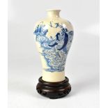 A c1900 Chinese meiping-shaped vase painted in blue and white with a figure amongst stylised
