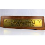 A brass plaque for Admiral Beatty over May 3rd 1917, mounted on partial oak plinth, 10 x 51cm,