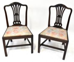 A set of four mahogany Hepplewhite-style dining chairs,