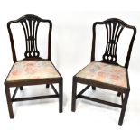 A set of four mahogany Hepplewhite-style dining chairs,