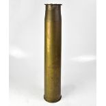 A large brass artillery shell case now with crimped rim, height 67cm.