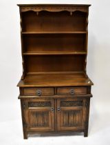 OLD CHARM FURNITURE; a reproduction oak dresser of small proportions,