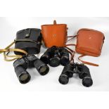 Three pairs of binoculars comprising a pair of Green Kat 30x50,