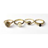 Four 9ct gold dress rings comprising a claw set oval white opal, size P,