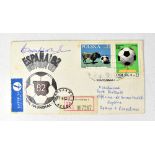 BOBBY MOORE; a first day cover bearing the star's signature.
