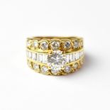 An 18ct gold ring set with central diamond, approx 1.