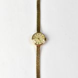 GARRARD; a ladies' 9ct gold crown wind wristwatch,