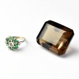 A large smoky quartz emerald cut stone,