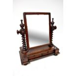 A Victorian mahogany swing toilet mirror on barleytwist columns, the base with two cushion drawers,
