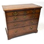 A late 18th/early 19th century mahogany chest of four drawers with brass swing handles,
