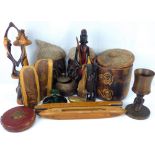 A collection of various vintage and modern carved wood items to include tribal heads, masks,
