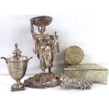 A silver plated cruet set in the form of a lady walking with basket upon head and a double basket
