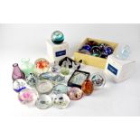 A quantity of glass paperweights to include bubble, millefiori and abstract swirl examples, etc.