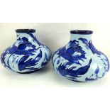 MOORCROFT; a modern pair of 'Peony' pattern squat vases,