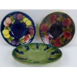 MOORCROFT; three mid-20th century pin dishes, comprising 'Pomegranate and Berry' pattern example,